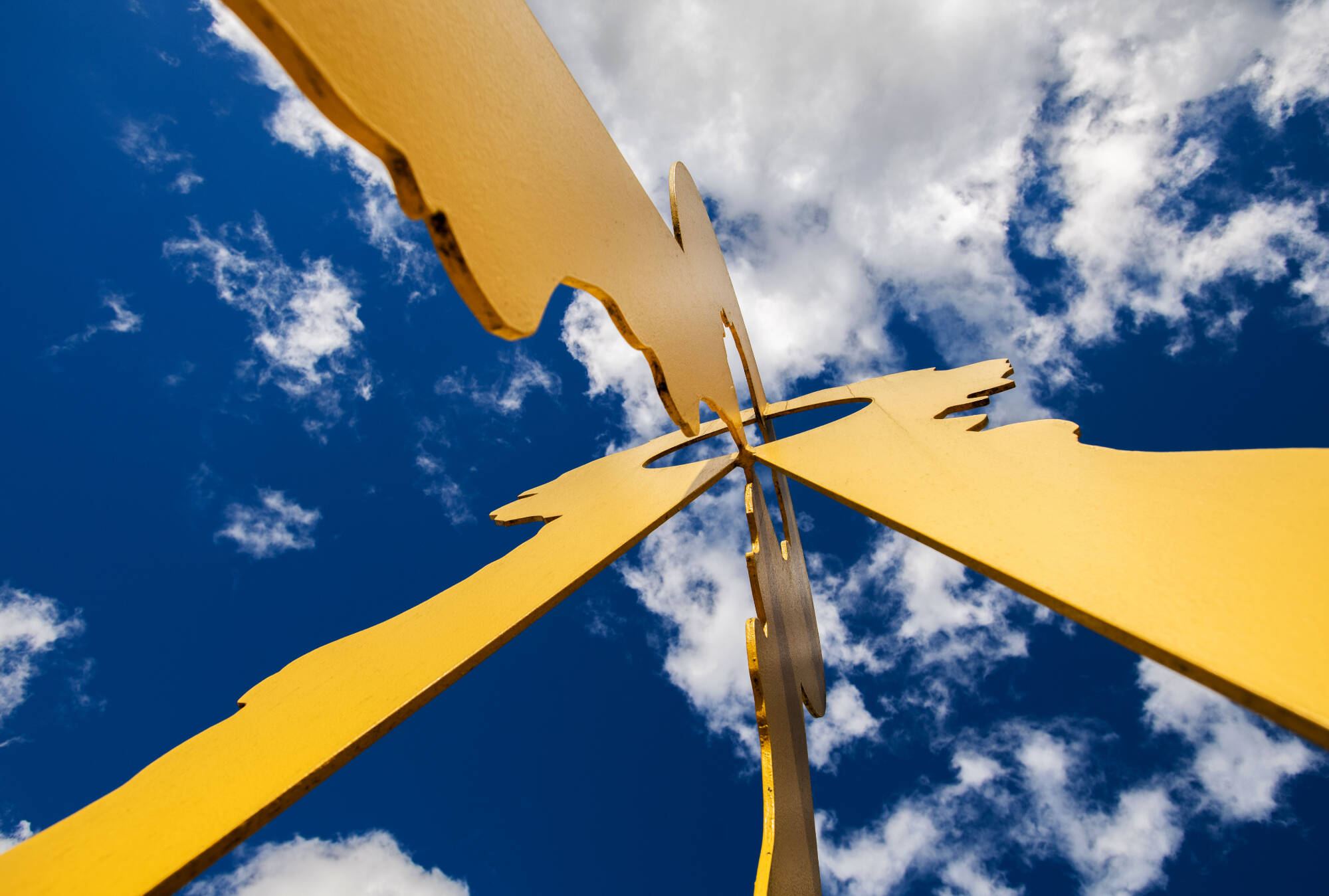 view from beneath a sculpture on campus looking up at the sky